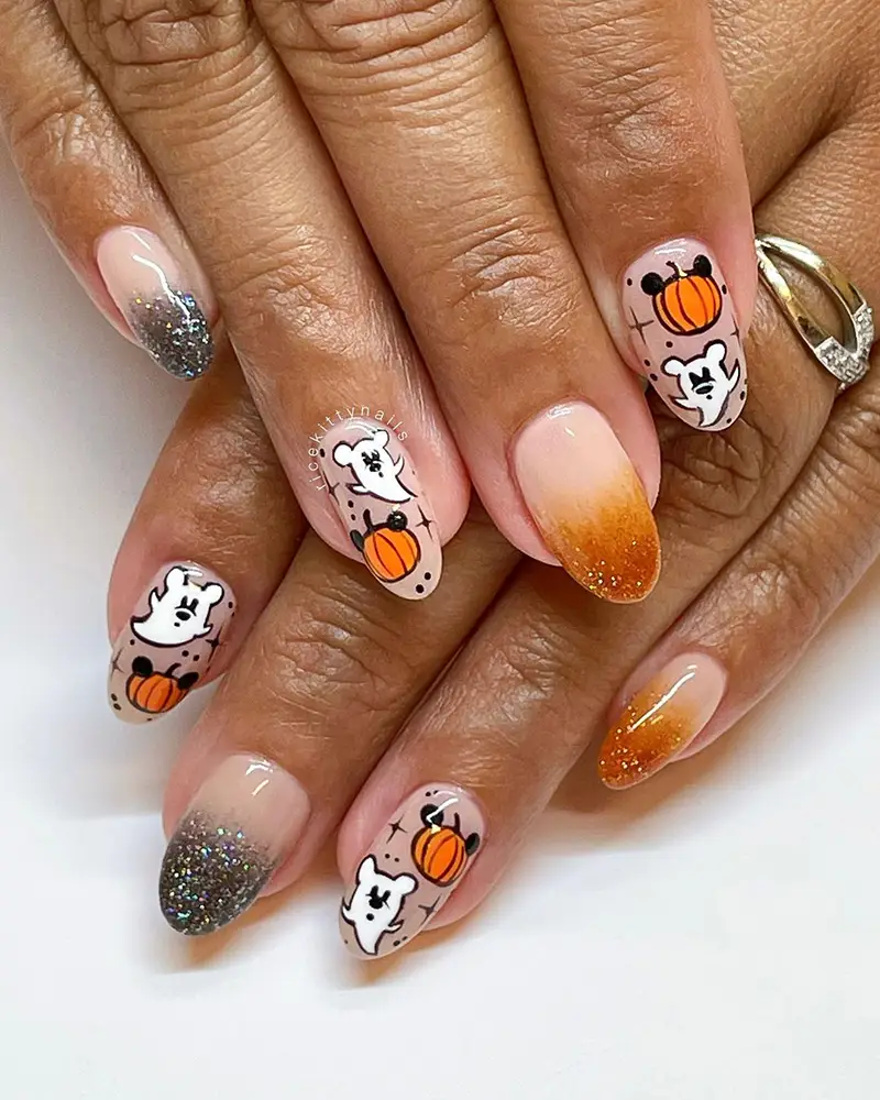 Cute Disney Halloween nails with ombre glitter