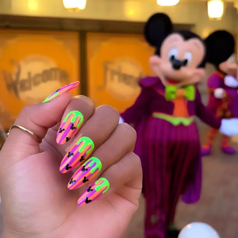 Disney Halloween nail design styled with the colors of Oogie Boogie Bash.