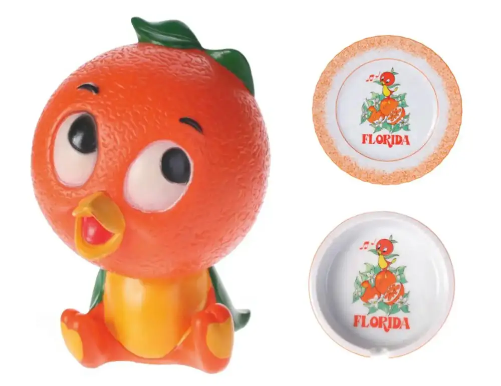 Vintage Disney Orange Bird merchandise: Orange Bird bank, Orange Bird plate, and Orange Bird ashtray.