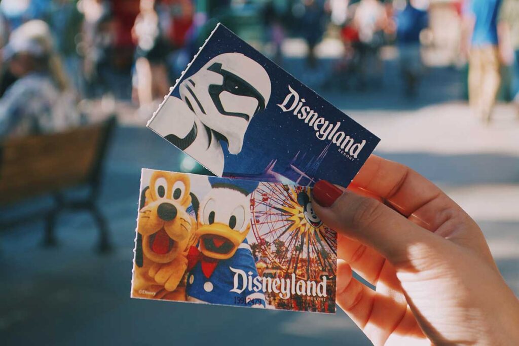 Disneyland paper tickets with Donald and Pluto on one and a stormtrooper on another.