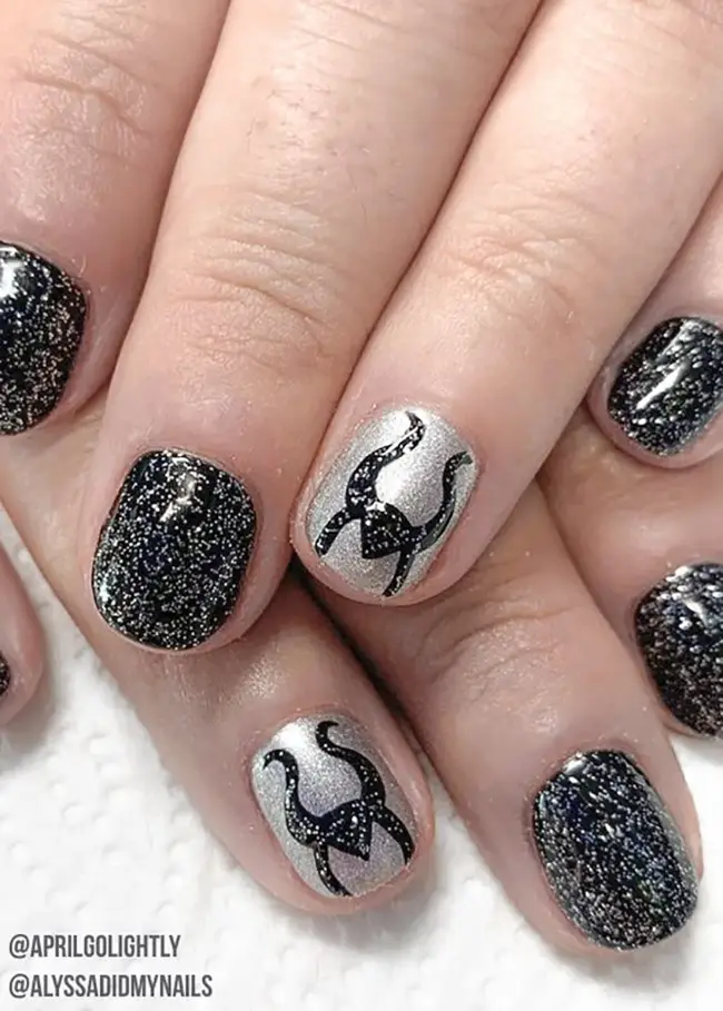 Black and silver glittery Maleficent nails