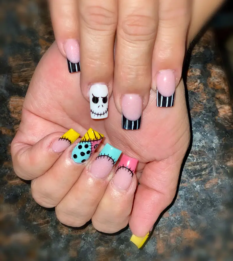 Nightmare Before Christmas nails for Halloween featuring Jack and Sally