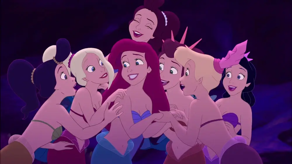 Ariel and her sisters smiling together.