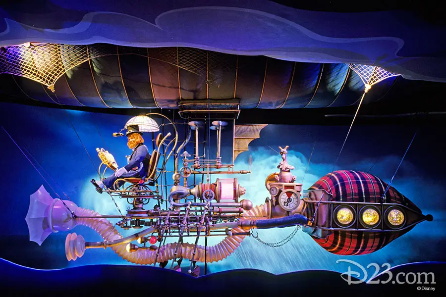 Dreamfinder on zeppelin-like contraption from the ride Journey into Imagination