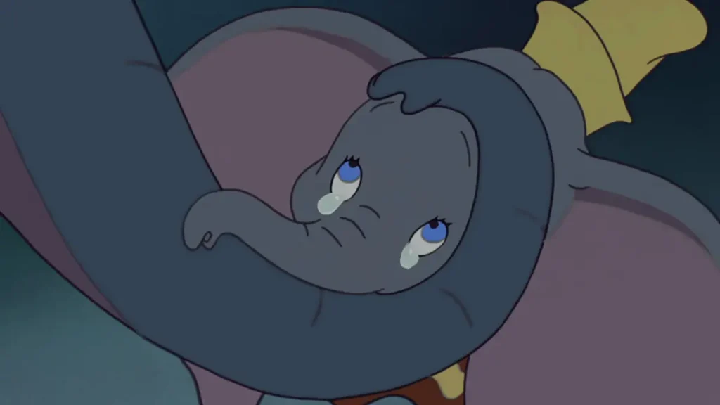 Sad scene in Disney movie where Dumbo cries seeing his mother