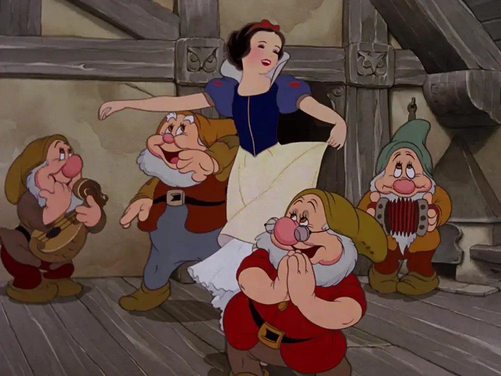 Snow White dances with seven dwarfs