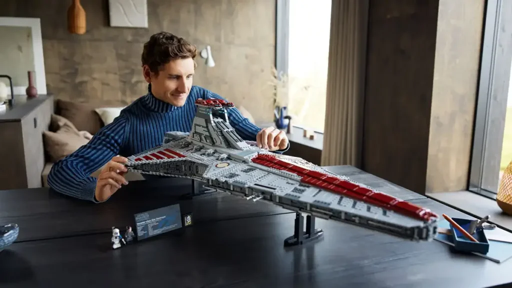 Adult building LEGO Star Wars set