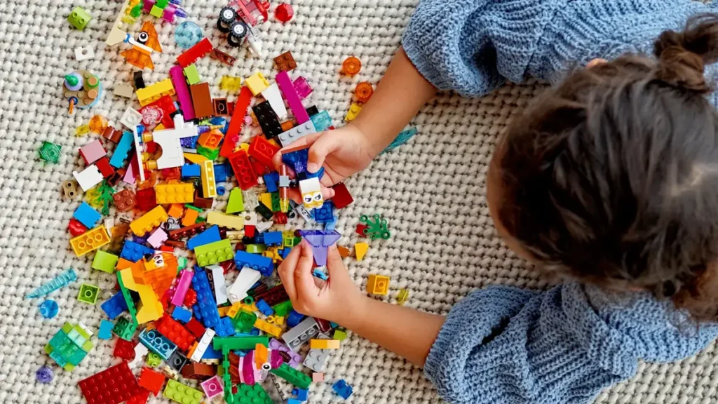 Kid playing with LEGO